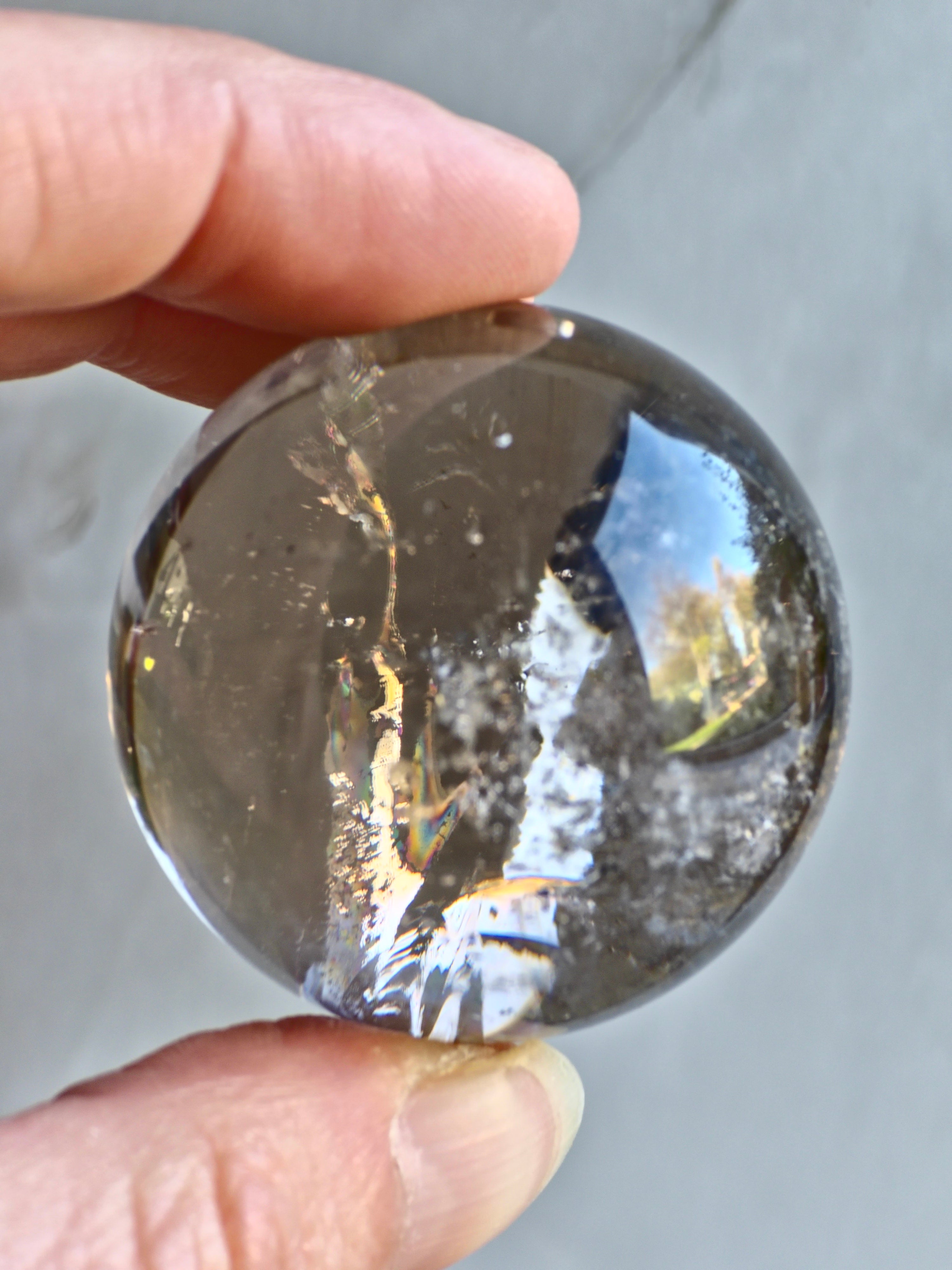 Smokey quartz sphere with rainbows - f