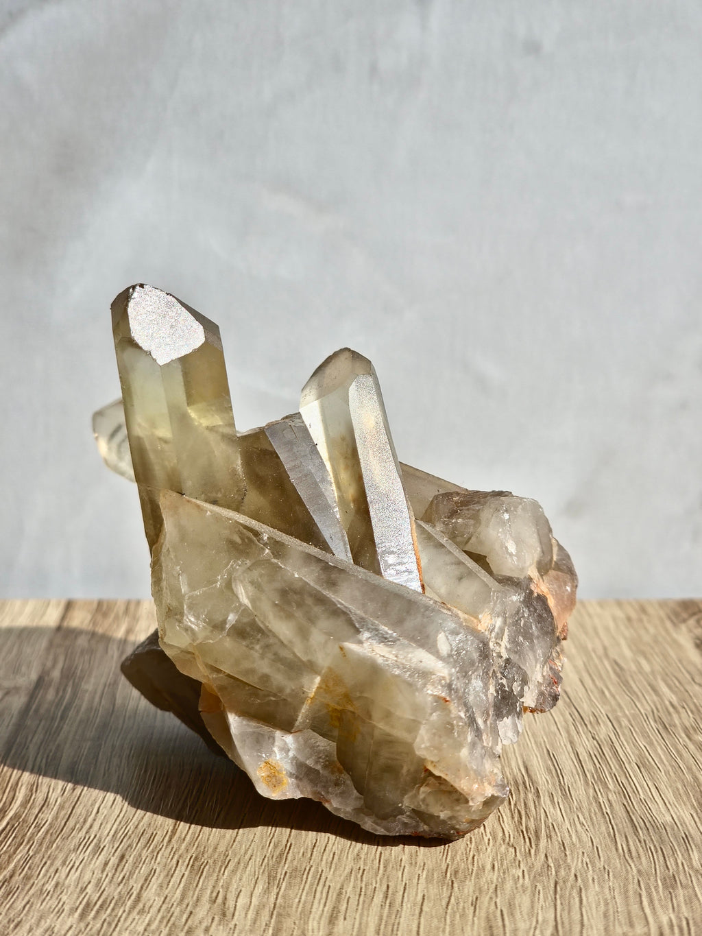 Natural citrine cluster with rainbow inclusion