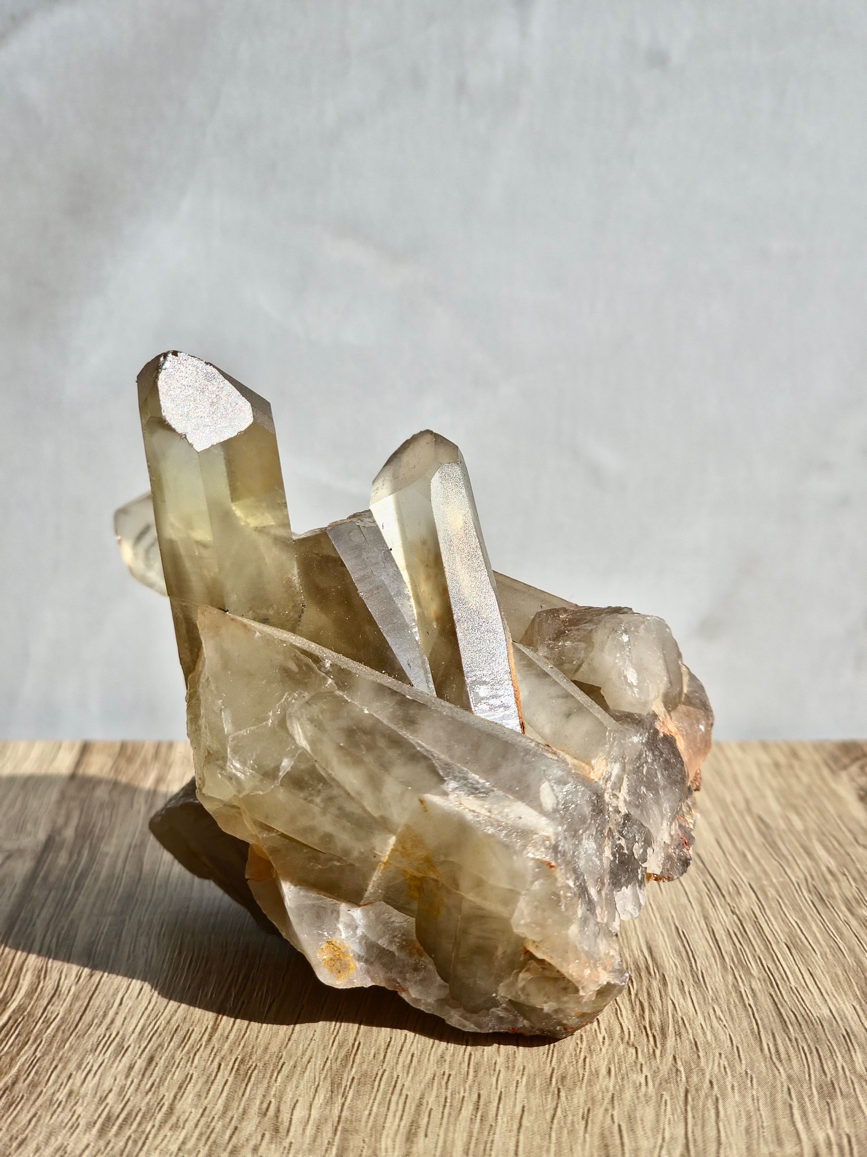Natural citrine cluster with rainbow inclusion