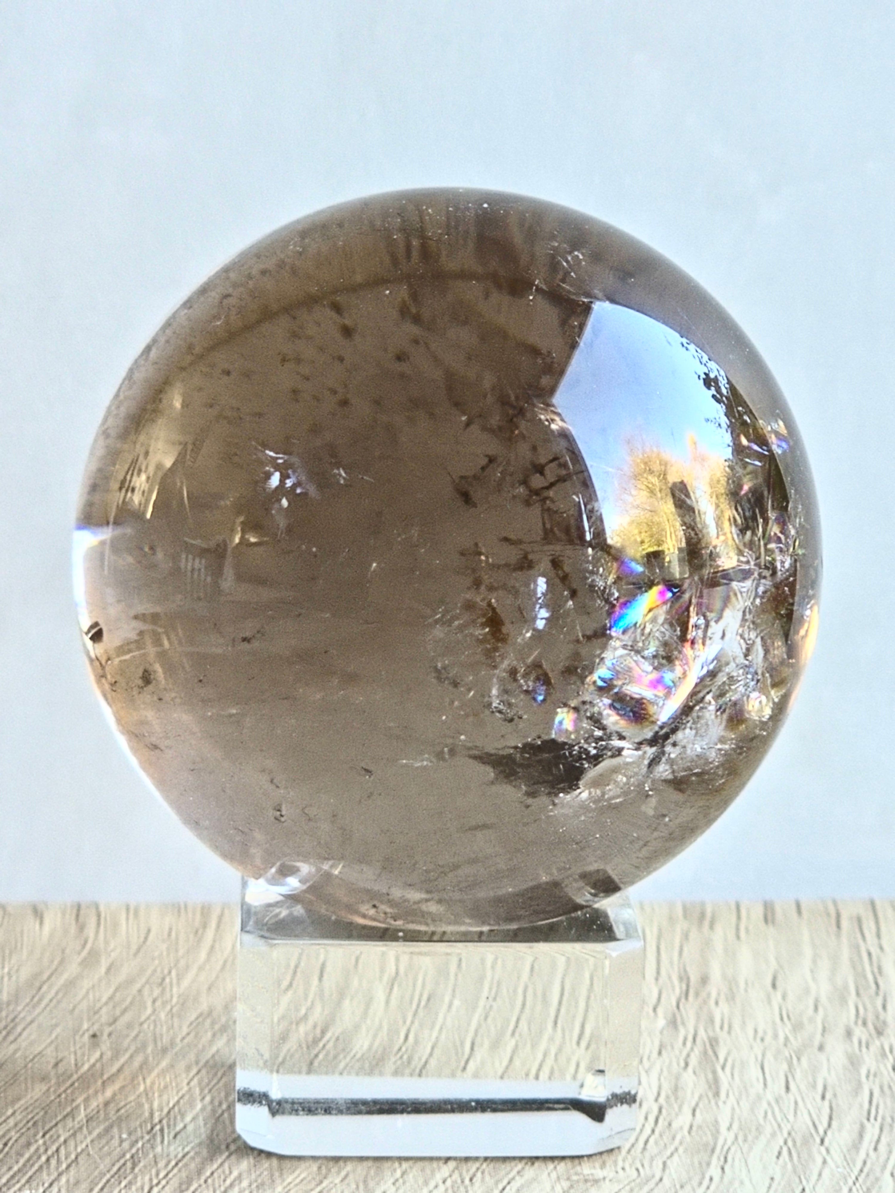Smoky quartz sphere with rainbows - c