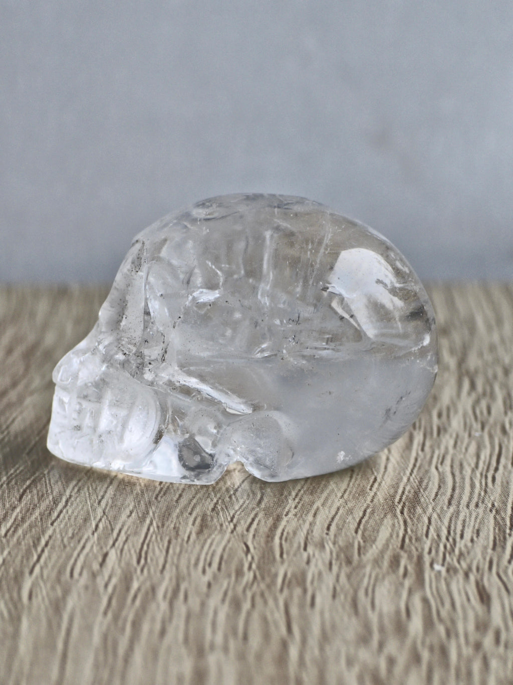 Clear quartz skull with rainbows - b