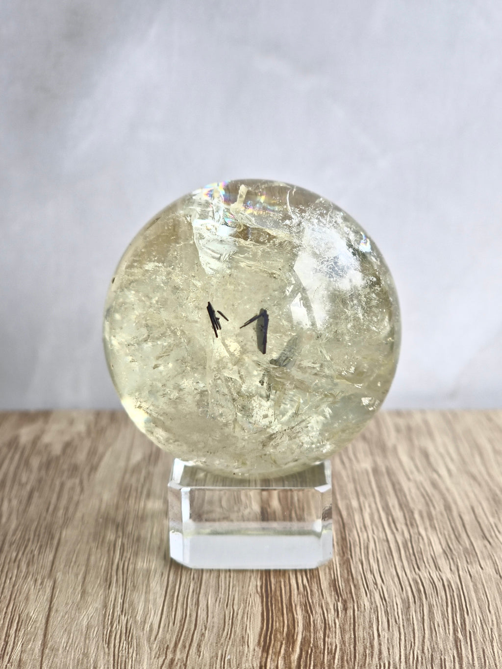 Citrine sphere with tourmaline inclusions