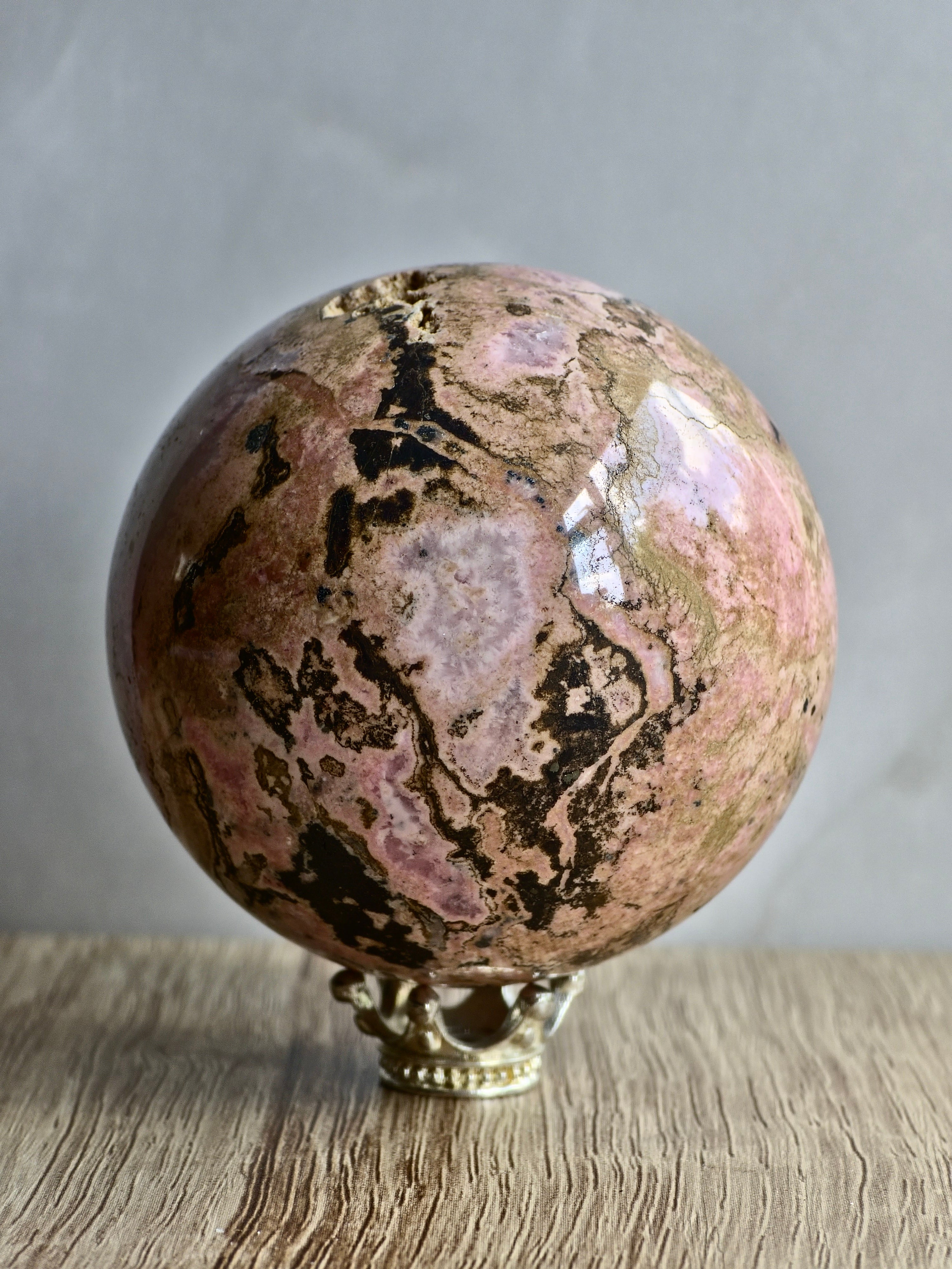 Peruvian Rhodonite Sphere — Pink Manganese Silicate with Quartz Pocket + Manganese Oxide Veining