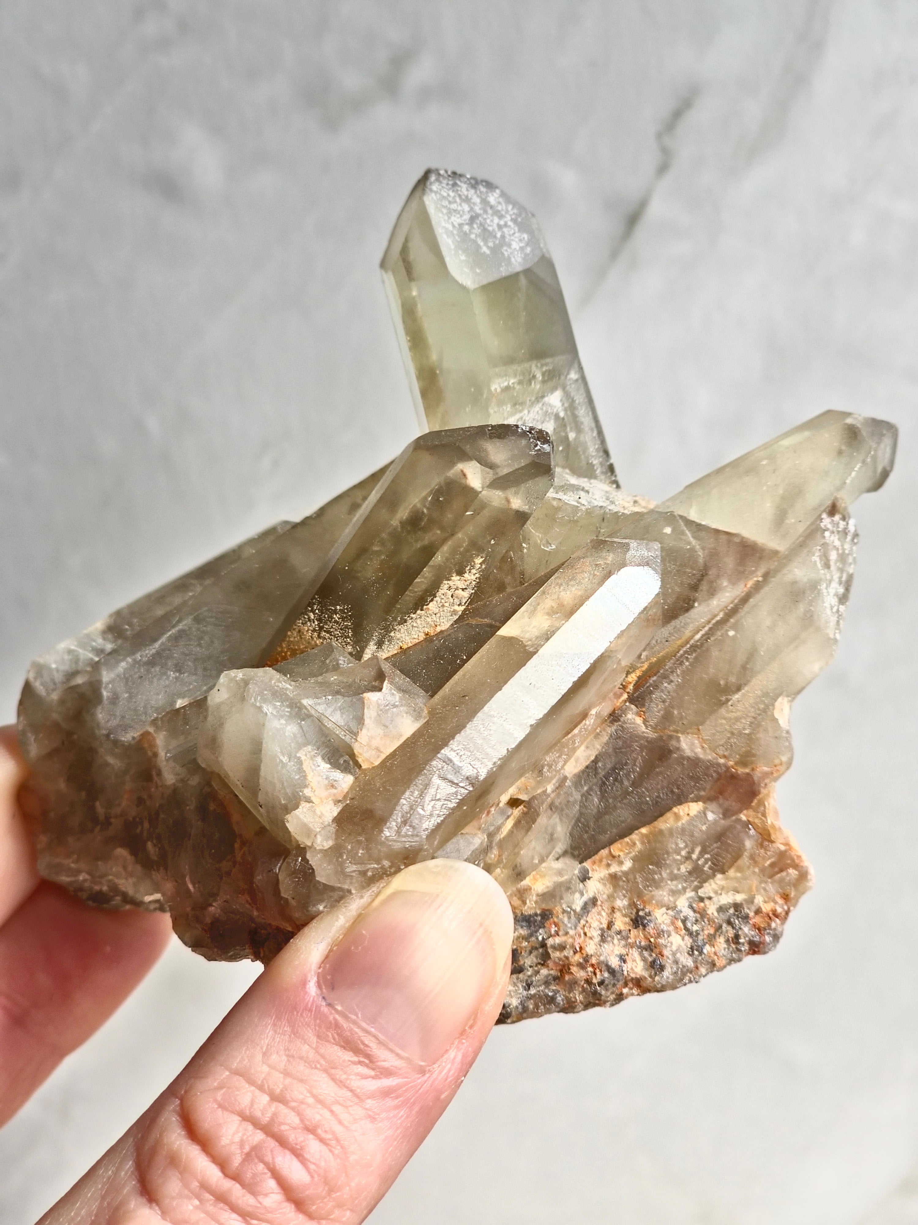 Natural citrine cluster with rainbow inclusion