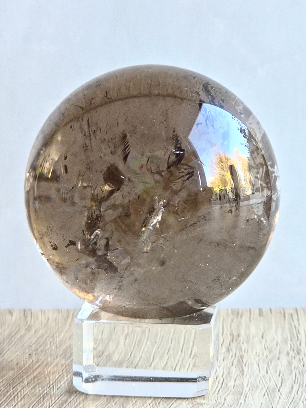 Smoky quartz sphere with rainbows - c