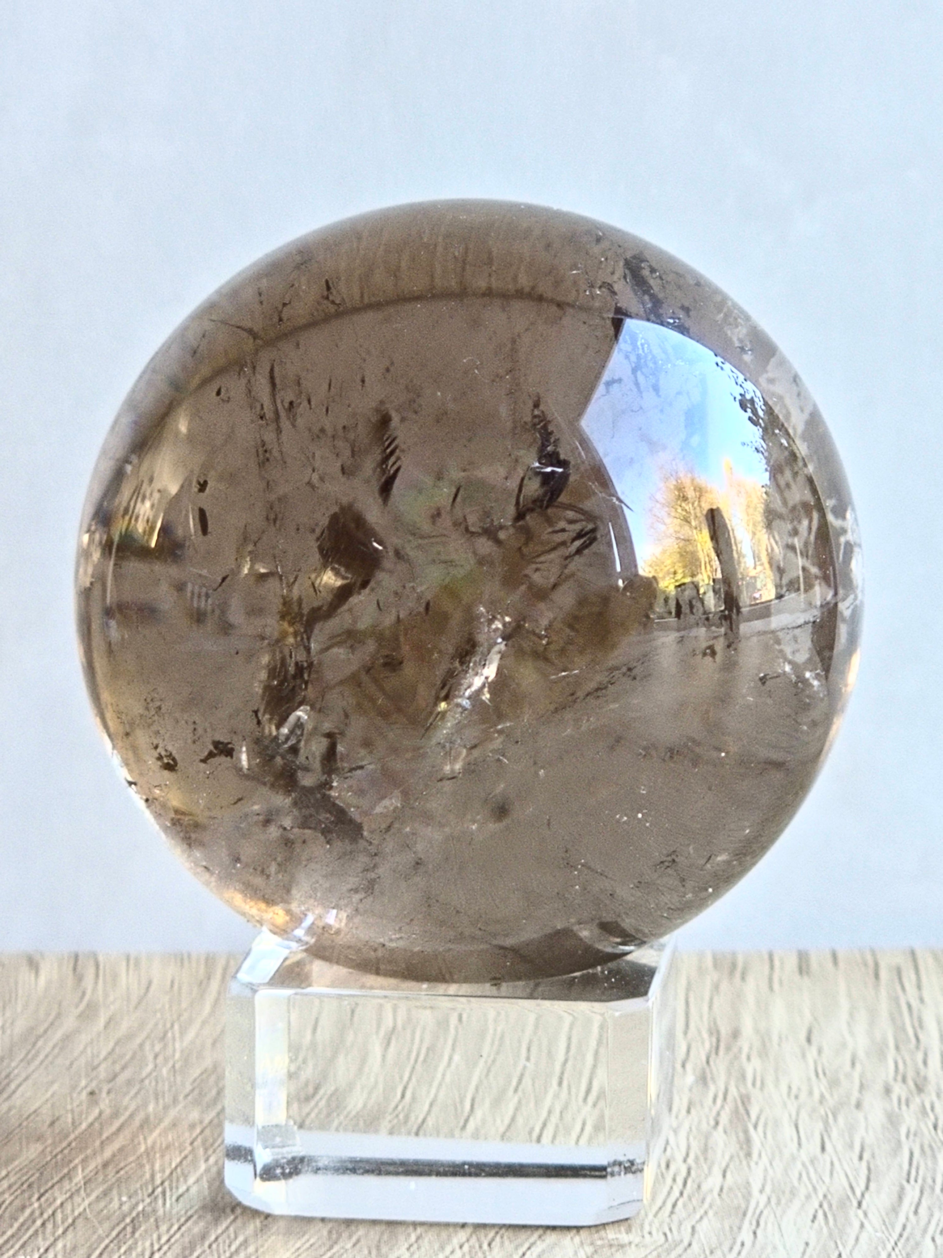 Smoky quartz sphere with rainbows - c