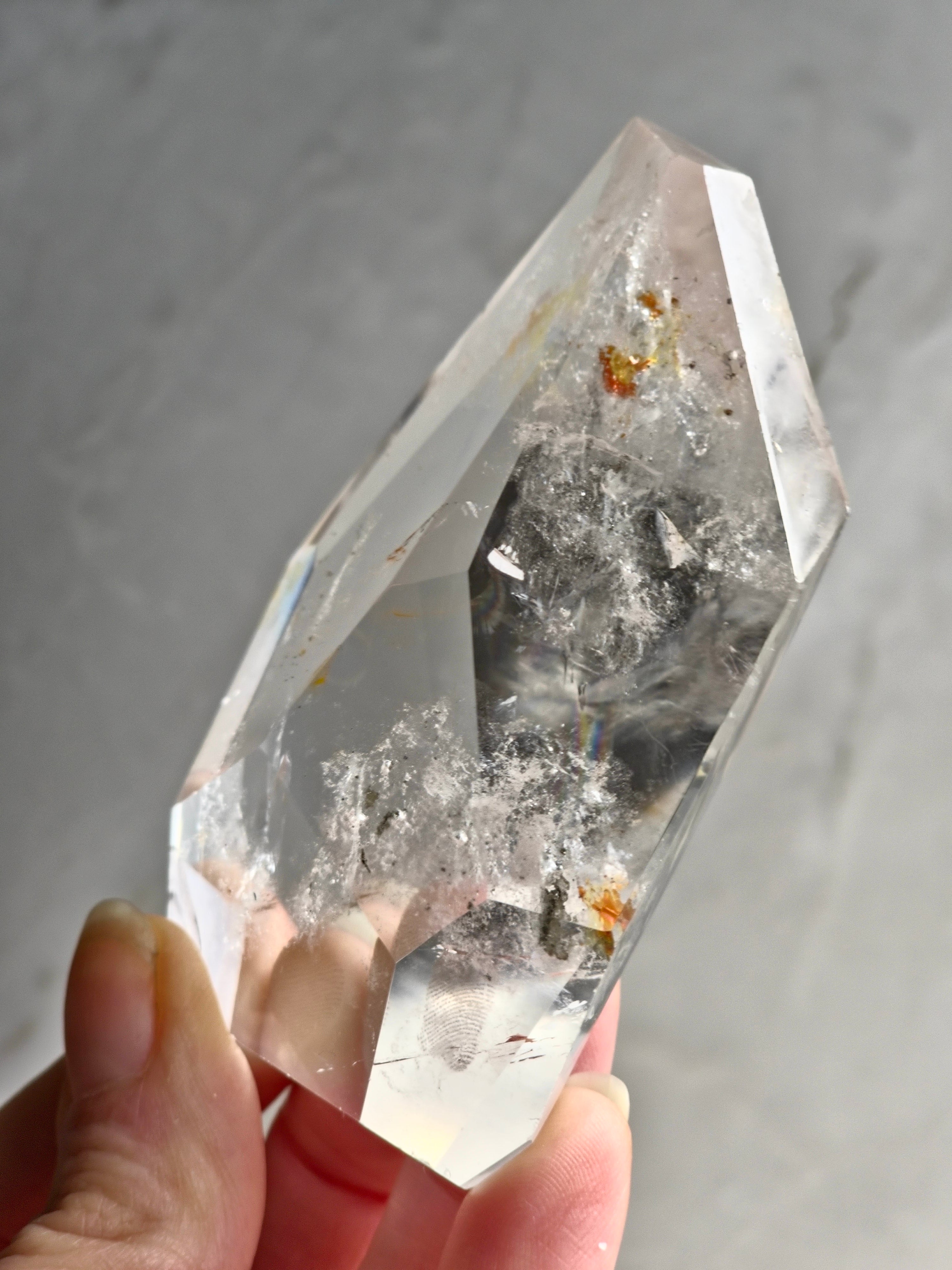Quartz freeform with iron and chlorite inclusions
