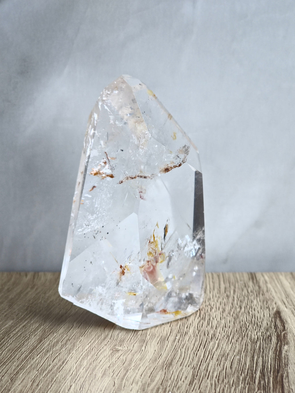 Quartz freeform with iron inclusions and rainbows