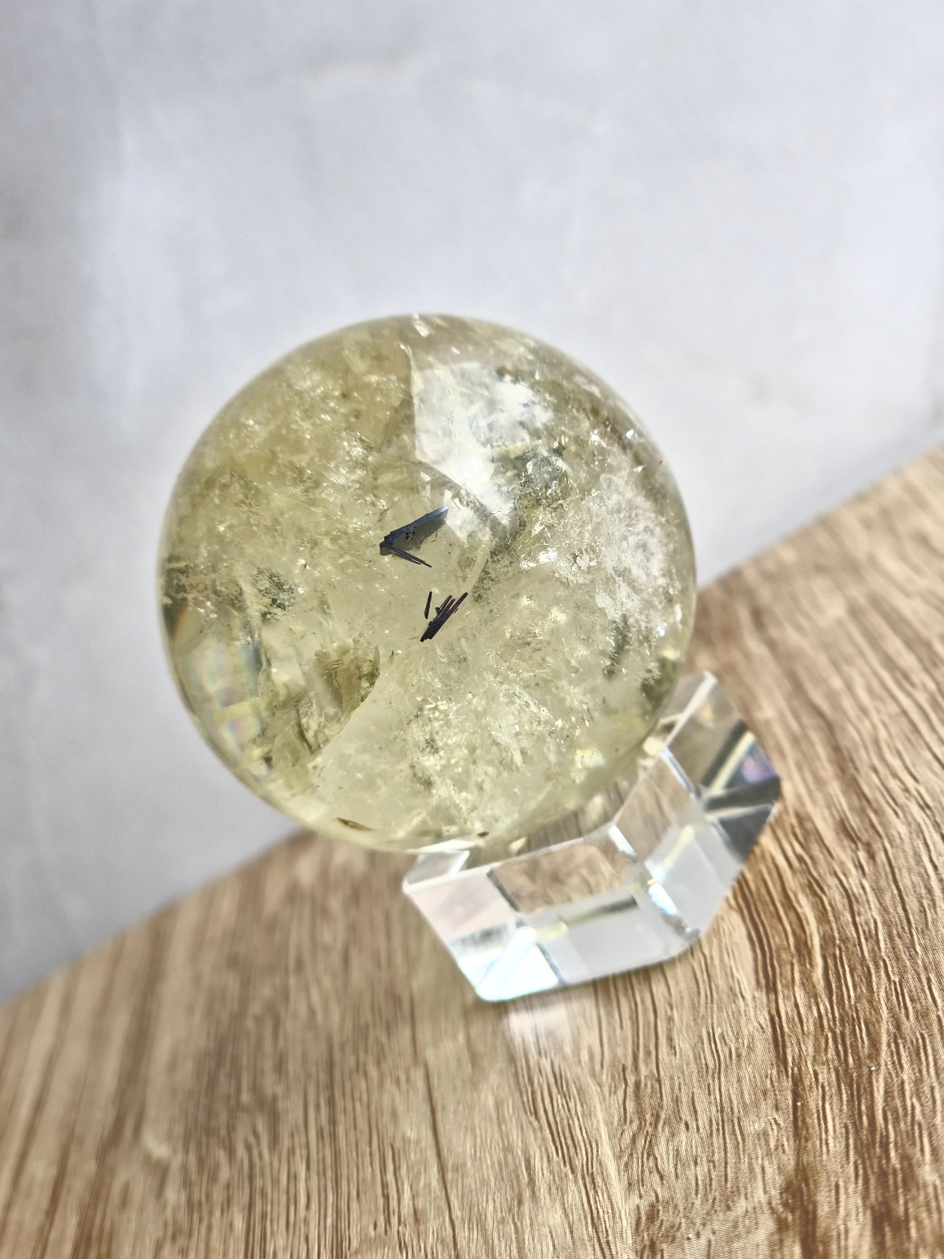 Citrine sphere with tourmaline inclusions