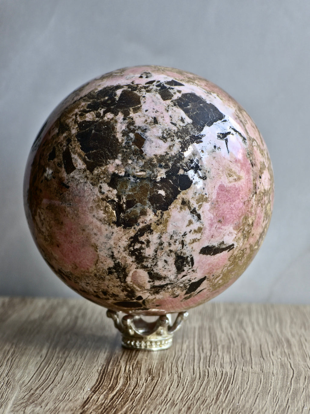 Peruvian Rhodonite Sphere — High-Contrast Pink with Manganese Oxide Matrix