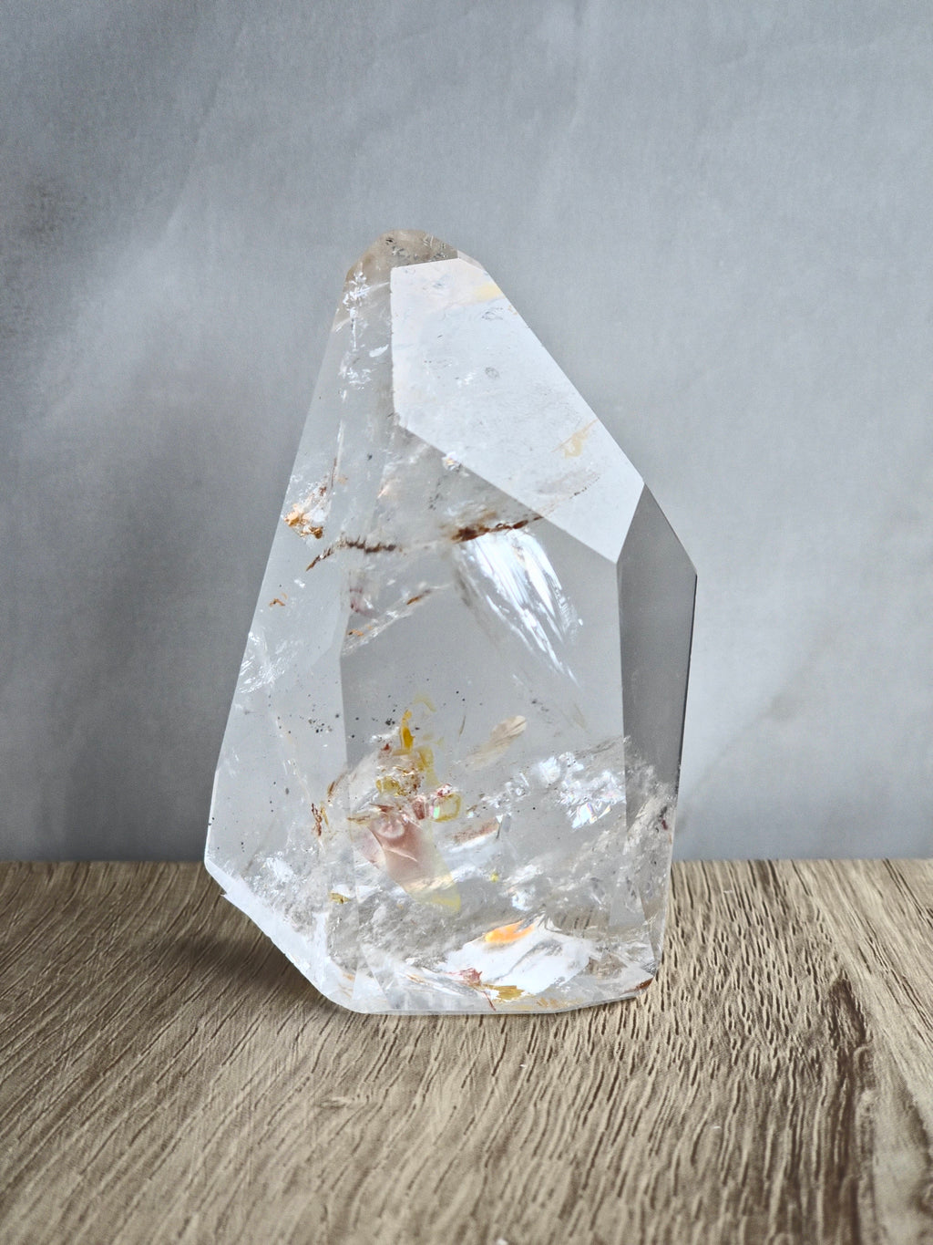 Quartz freeform with iron inclusions and rainbows