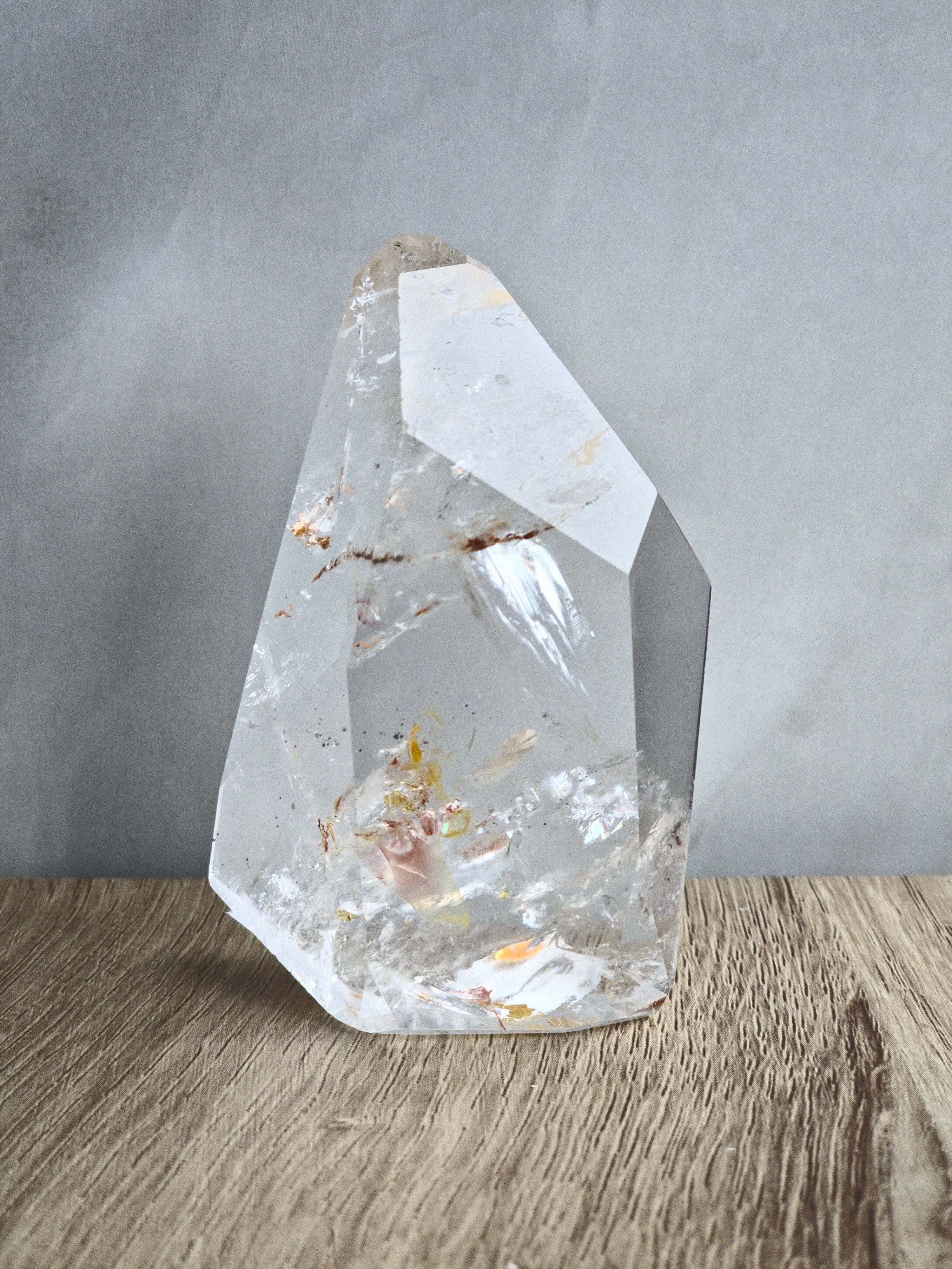 Quartz freeform with iron inclusions and rainbows