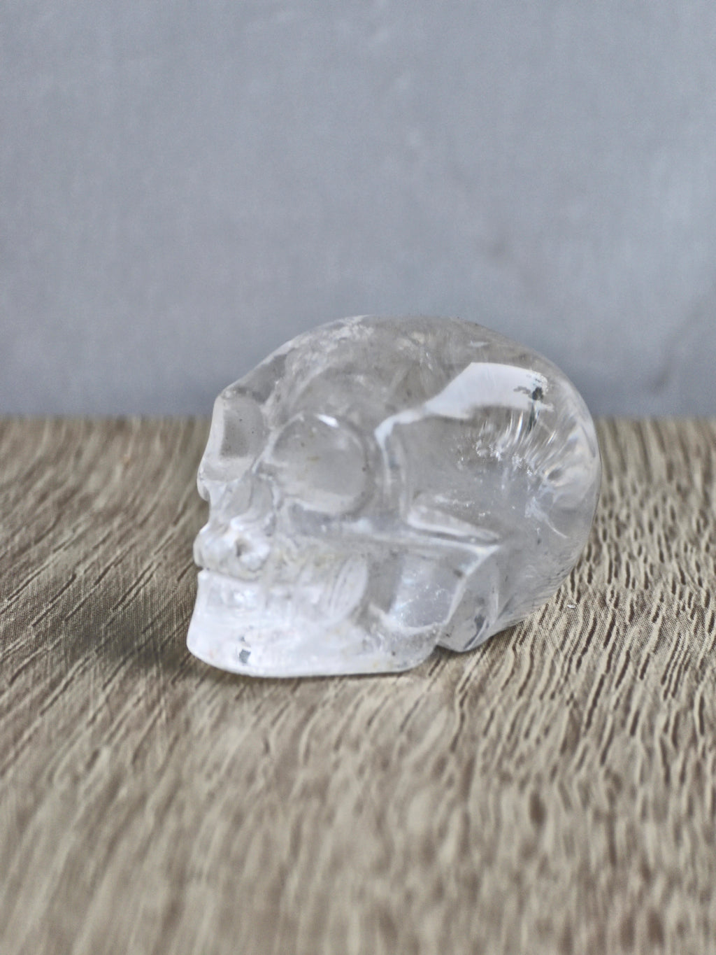 Clear quartz skull with rainbow - c