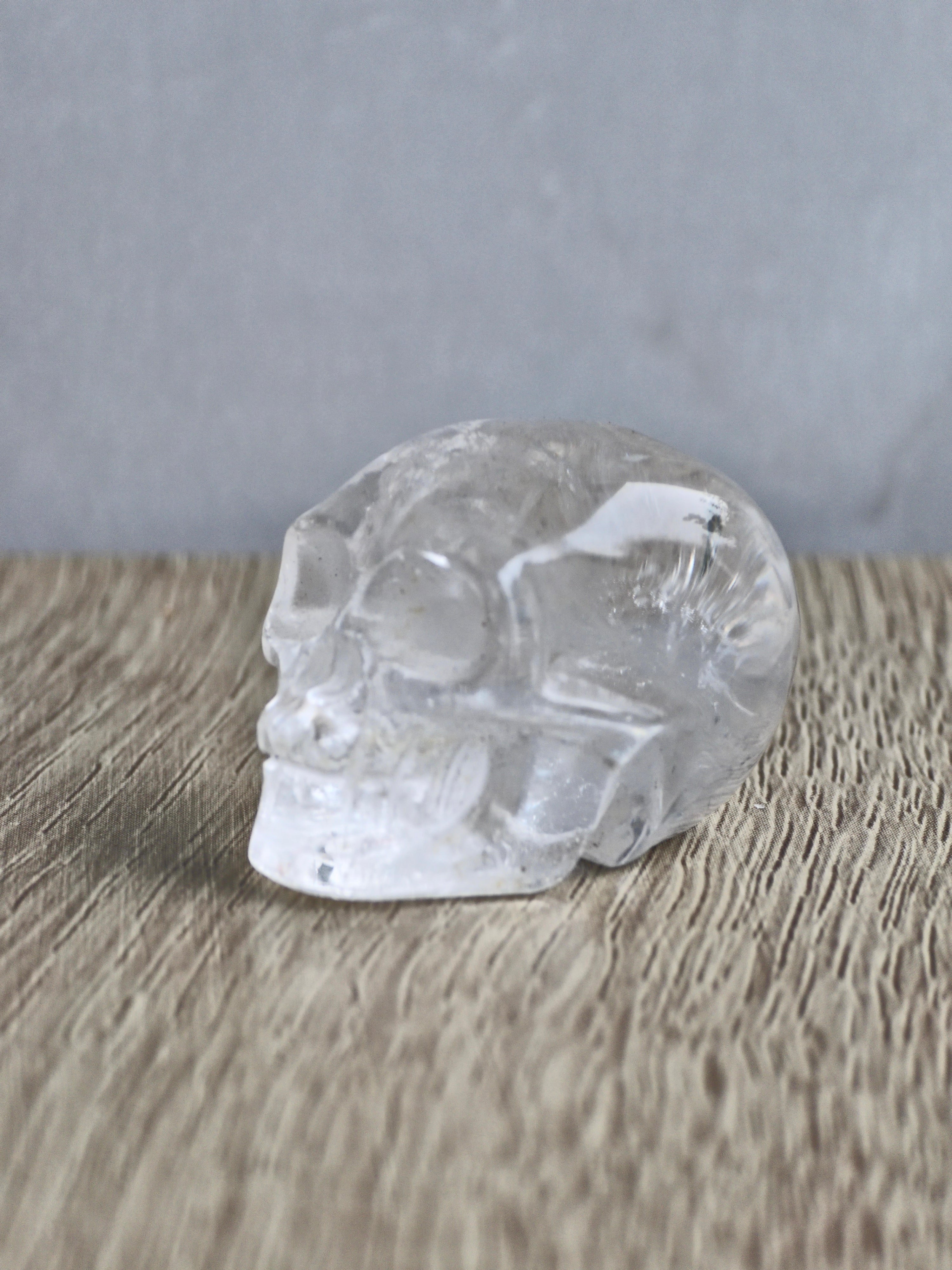 Clear quartz skull with rainbow - c