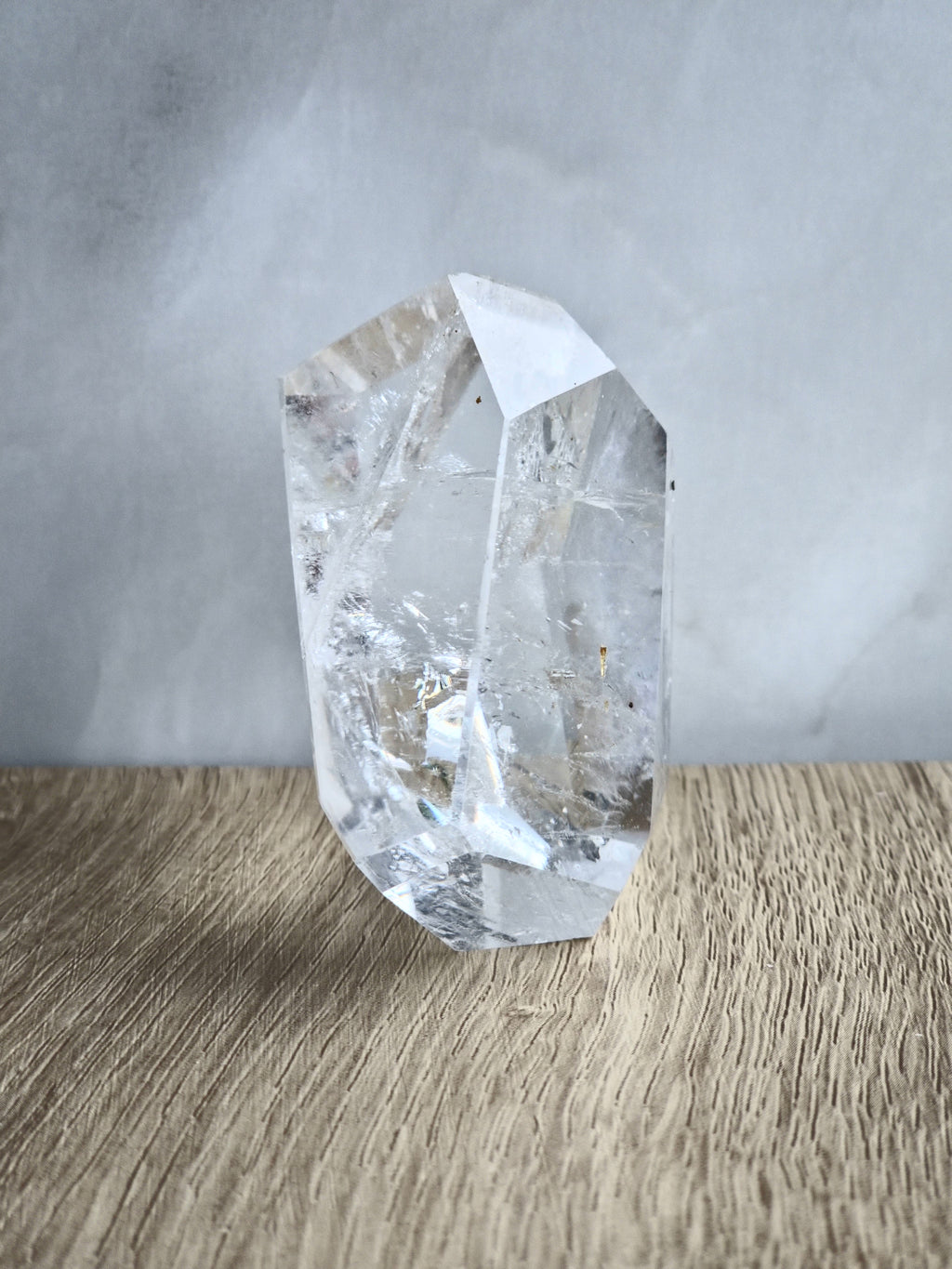 Quartz freeform with iron inclusions and rainbow
