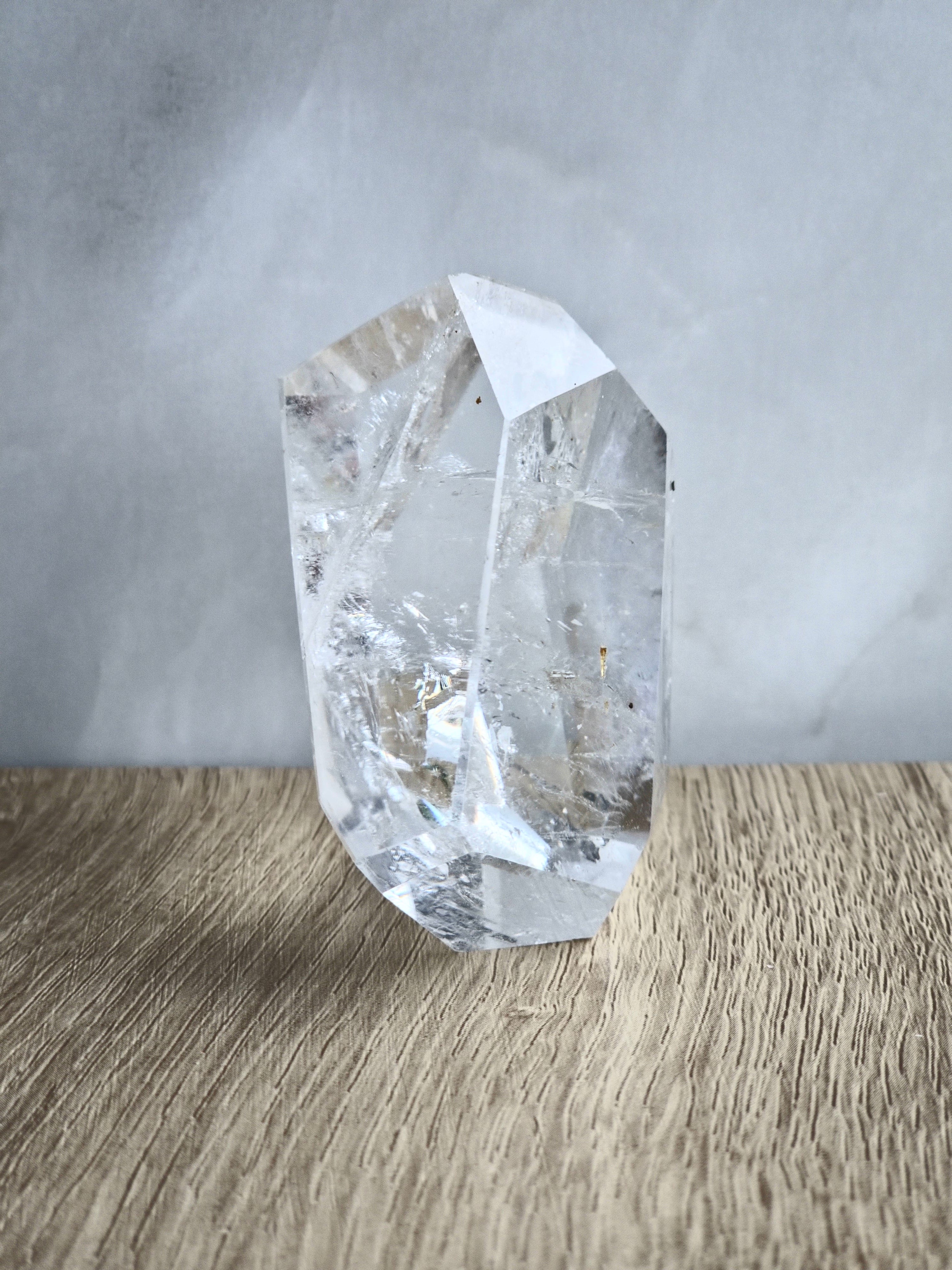 Quartz freeform with iron inclusions and rainbow